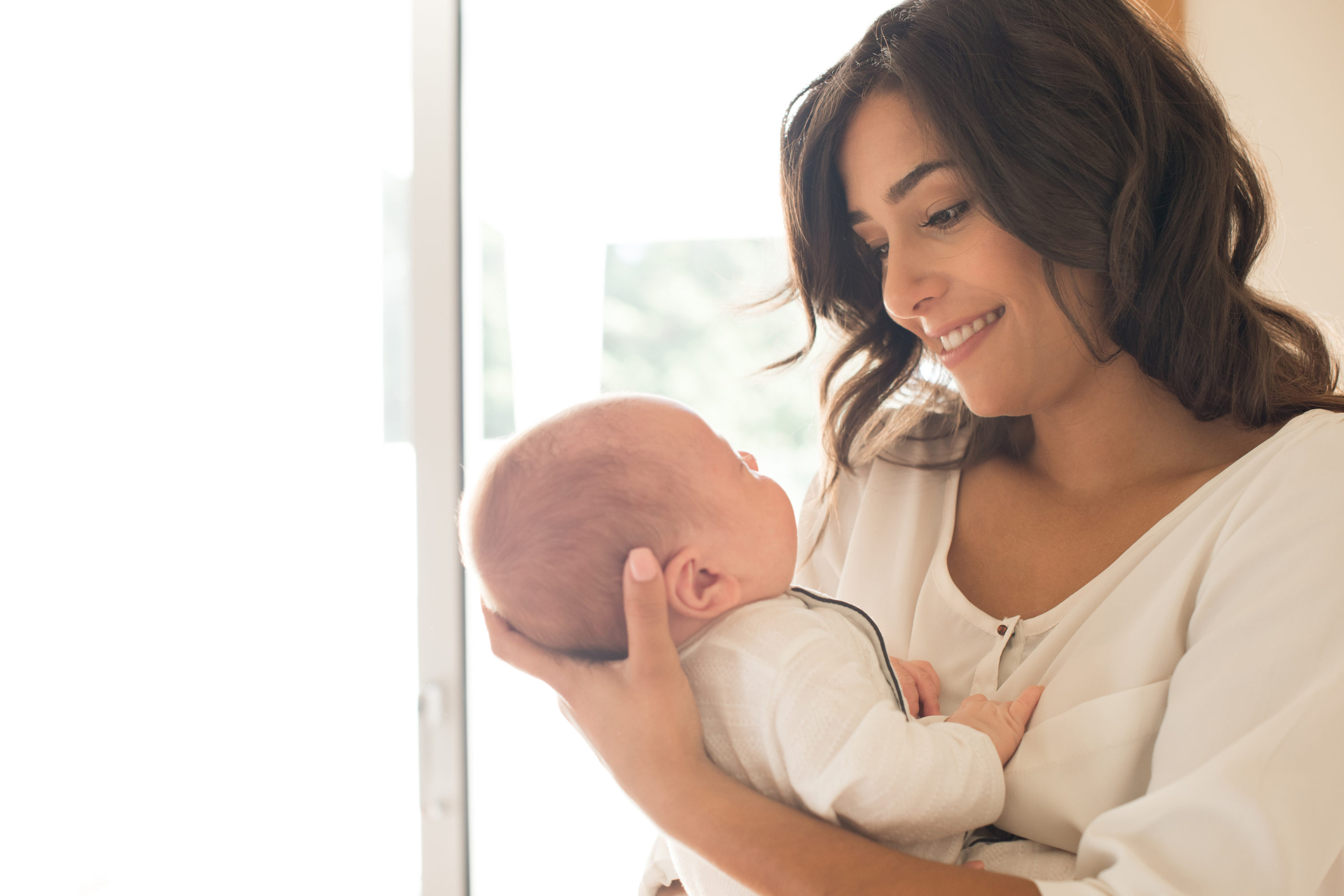 A mother holding her baby