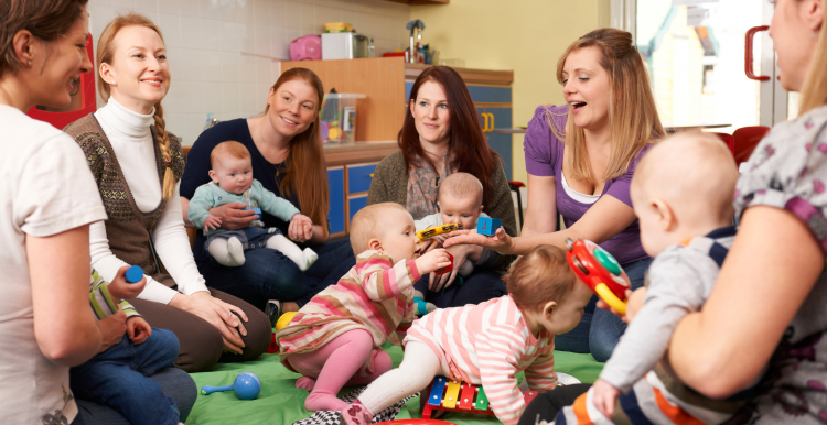 Mothers sat in a circle with their babies