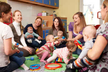 Mothers sat in a circle with their babies