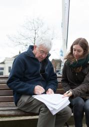 two people sat on bench at healthwatch event